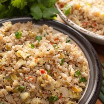 Cauliflower rice cooked with onion, bell peppers, and eggs. This cauliflower rice stir fry with eggs is an easy and healthy recipe without compromising the taste. One of the best ways to make cauliflower rice. This works out well for Paleo/Gluten-free/Keto lifestyle.