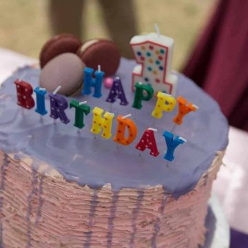 Moist and rich white chocolate cake with white chocolate cream cheese and raspberry filling, and frosted with white chocolate ganache. The white chocolate cake is our family favorite cake recipe, and I went with the same flavor for my daughter Eva's first birthday cake.