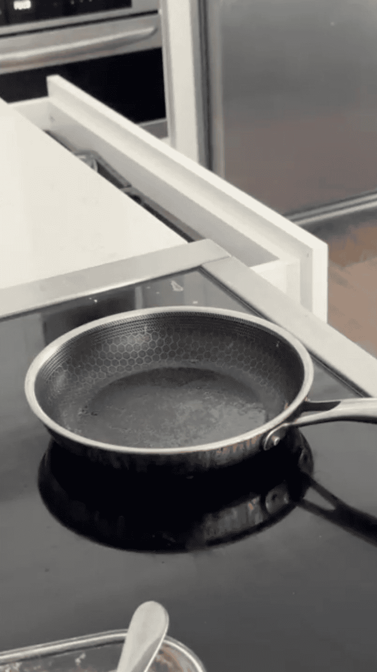 A pan is placed on the stove.