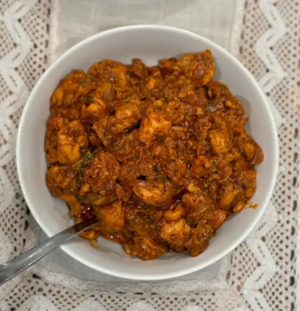 Chicken Ghee Roast served in a white bowl.